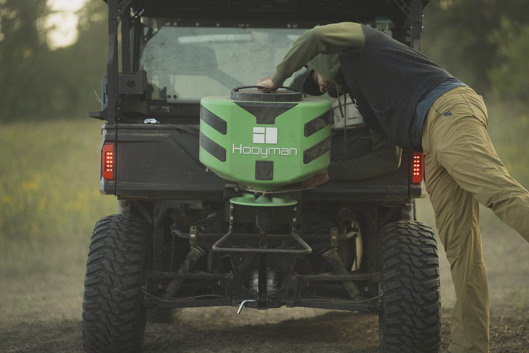 Hooyman 125 lb vehicle spreader mounted on an ATV