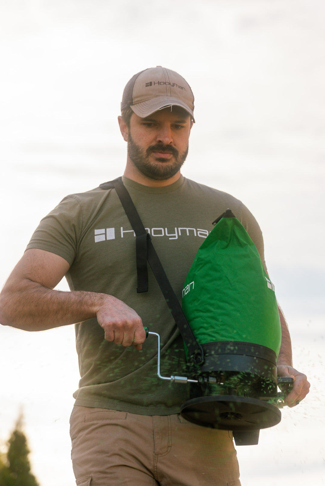 Hooyman bag spreader in use seeding a food plot
