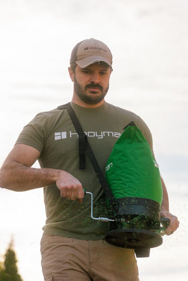 Hooyman bag spreader in use seeding a food plot